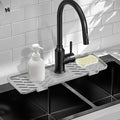 Silicone Faucet Mat for Kitchen Sink – Gen 3 10° Slope Splash Guard with Cuttable Hole – 14” x 5.5” Drip Catcher & Sponge Holder for Kitchen, Bathroom (Gray)