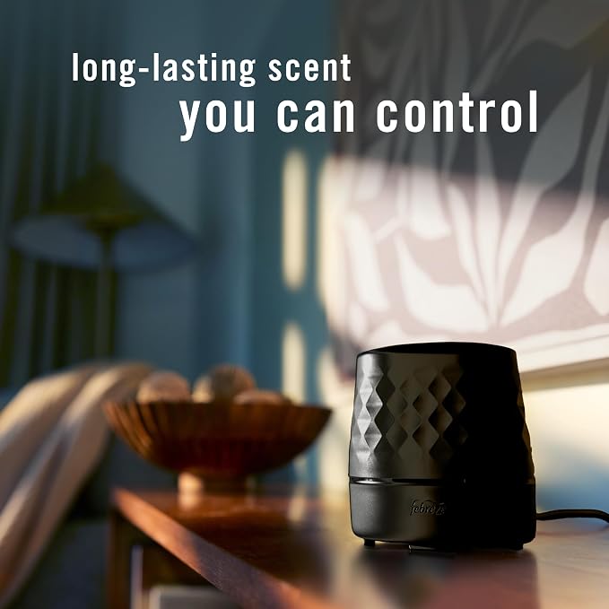 Febreze Plug in Scent Booster Air Freshener Oil Diffuser Black | Black Plug-in oil diffuser. Boosts scent for 40 mins. Long cord for flexible placement. Fits every home. Starter kit only.
