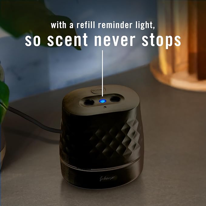 Febreze Plug in Scent Booster Air Freshener Oil Diffuser Black | Black Plug-in oil diffuser. Boosts scent for 40 mins. Long cord for flexible placement. Fits every home. Starter kit only.