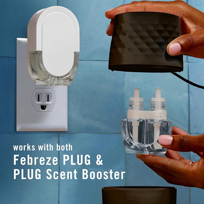 Febreze Plug in Scent Booster Air Freshener Oil Diffuser Black | Black Plug-in oil diffuser. Boosts scent for 40 mins. Long cord for flexible placement. Fits every home. Starter kit only.